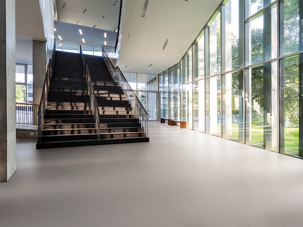 hall with norament kivo™ rubber flooring with the look of concrete