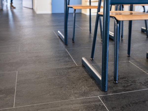 durable flooring in class-room: norament arago, installed in tiles