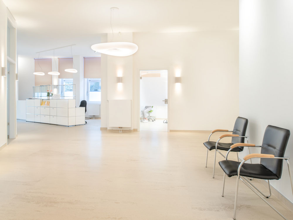 aesthetic of purist minimalism with maxiumum functionality: dental practice with norament 926 castello flooring