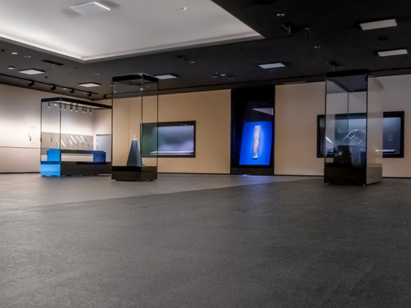 Large, open museum hall with display cases