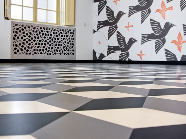 Flooring inlays create a hypnotic depth effect, the rhombuses have been pre-cut to size by the flooring manufacturer nora systems